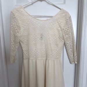 Simple, off-white dress with Aztec lace.